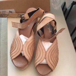 Free People ankle strap peep toe clogs in natural.